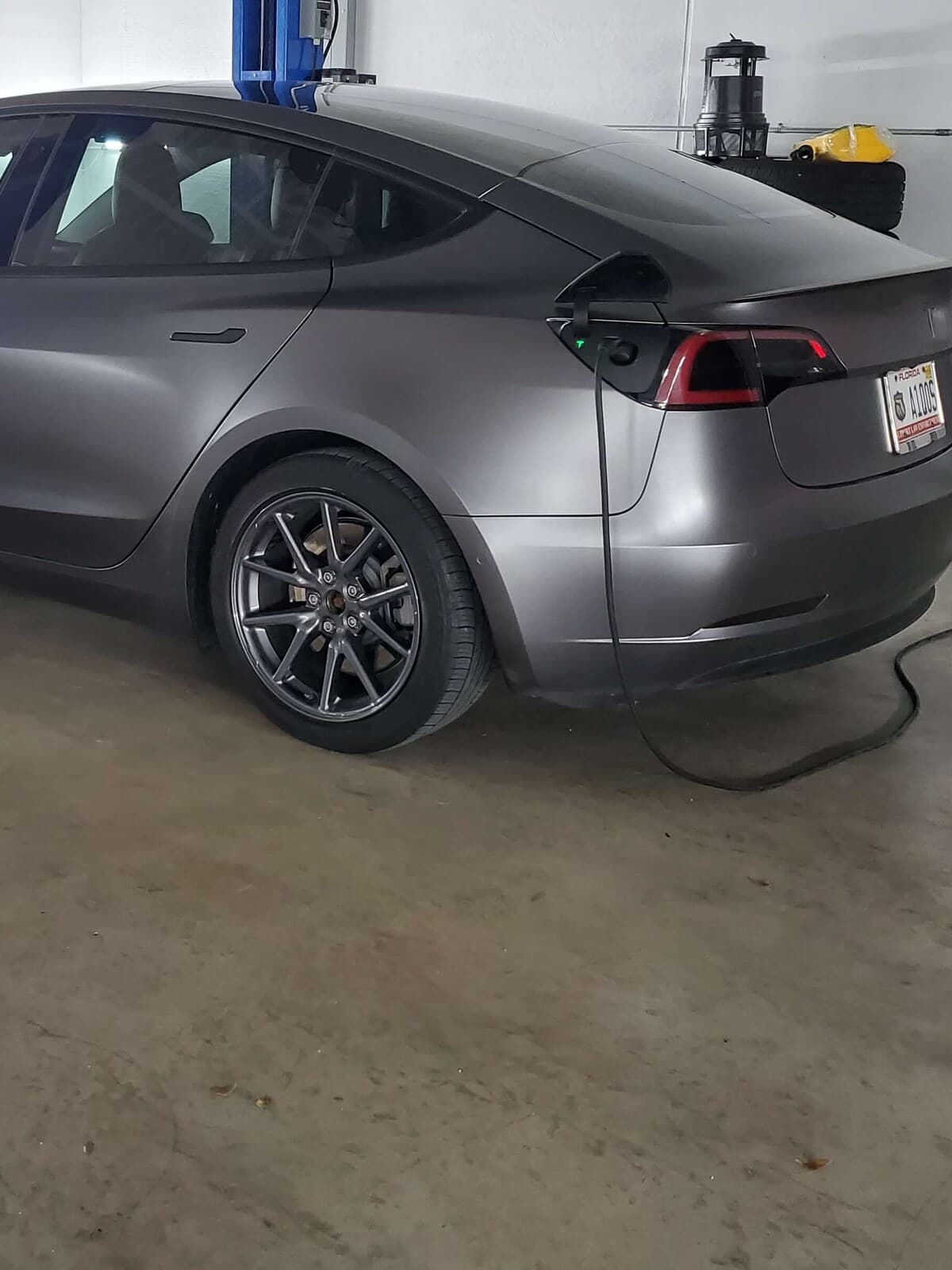 Tesla EV charging in a service bay